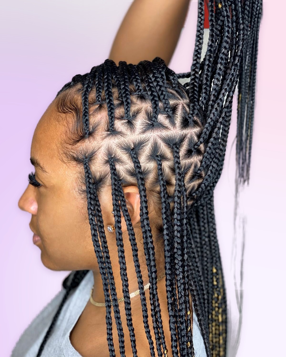 Triangle knotless braids styled at Braids Worth